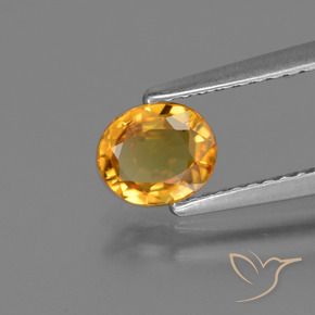 Zafiro Dorado naranja oscuro natural de 0.73 ct, Ovalada, VS