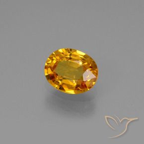 Zafiro Dorado naranja oscuro natural de 0.78 ct, Ovalada, VS
