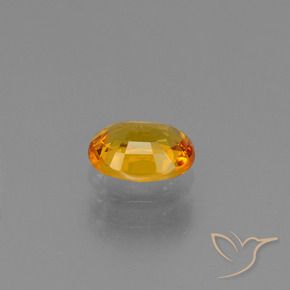 Zafiro Dorado naranja oscuro natural de 0.78 ct, Ovalada, VS
