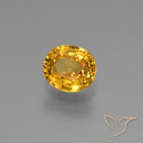 Zafiro Dorado oscuro natural de 0.88 ct, Ovalada, VS