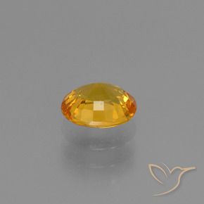 Zafiro Dorado oscuro natural de 0.88 ct, Ovalada, VS