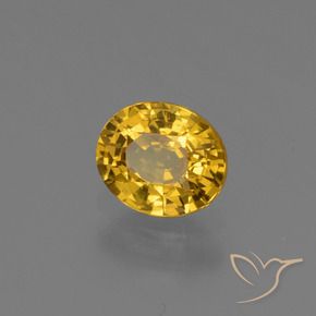 Zafiro Dorado oscuro natural de 0.73 ct, Ovalada, VS
