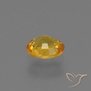 Zafiro Dorado oscuro natural de 0.73 ct, Ovalada, VS