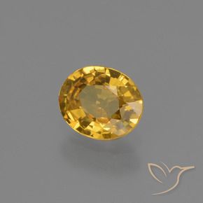 Zafiro Naranja dorado intenso natural de 0.64 ct, Ovalada, VS