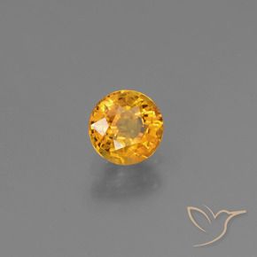 Zafiro Dorado naranja oscuro natural de 0.77 ct, Redondo, VS