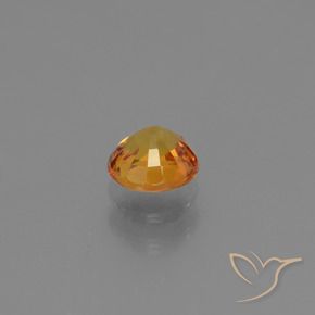 Zafiro Dorado naranja oscuro natural de 0.77 ct, Redondo, VS