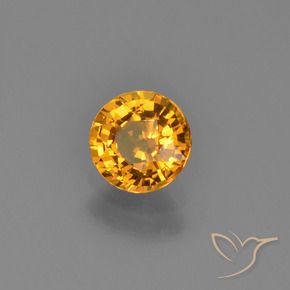 Zafiro Dorado naranja intenso natural de 0.70 ct, Redondo, VVS-VS