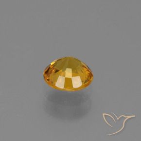 Zafiro Dorado naranja intenso natural de 0.70 ct, Redondo, VVS-VS