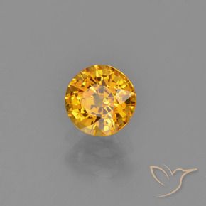 Zafiro Naranja dorado intenso natural de 0.72 ct, Redondo, VVS