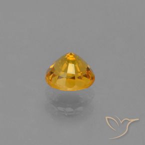 Zafiro Naranja dorado intenso natural de 0.72 ct, Redondo, VVS