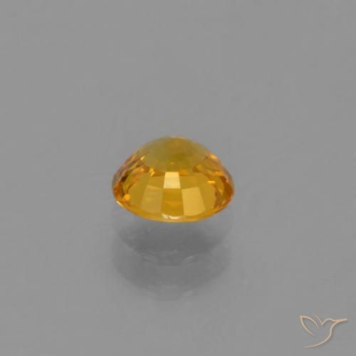 Zafiro Naranja dorado intenso natural de 0.66 ct, Redondo, VVS-VS