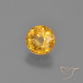 Zafiro Naranja dorado intenso natural de 0.73 ct, Redondo, VS