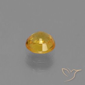 Zafiro Naranja dorado intenso natural de 0.73 ct, Redondo, VS