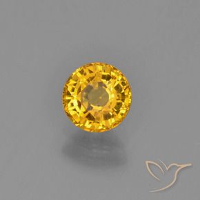 Zafiro Dorado oscuro natural de 0.72 ct, Redondo, VVS