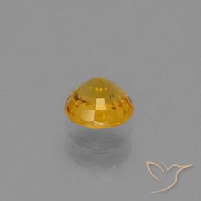 Zafiro Dorado oscuro natural de 0.72 ct, Redondo, VVS