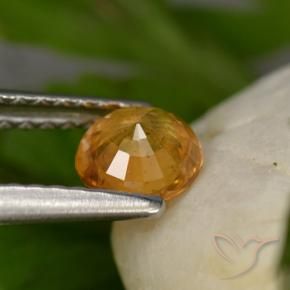 Zafiro Dorado naranja intenso natural de 0.58 ct, Redondo, VS