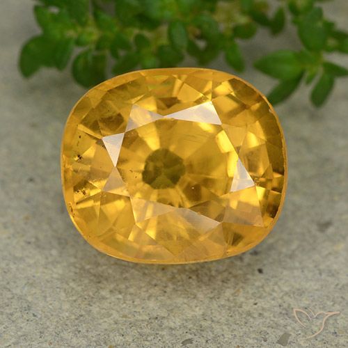 Zafiro Naranja dorado intenso natural de 6.85 ct, Ovalada, VS-SI