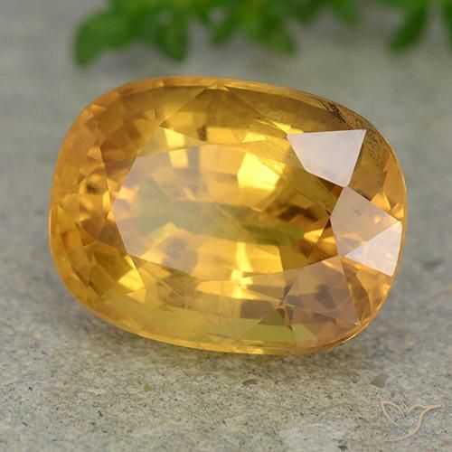 Zafiro Dorado naranja intenso natural de 9.36 ct, Ovalada, VS-SI