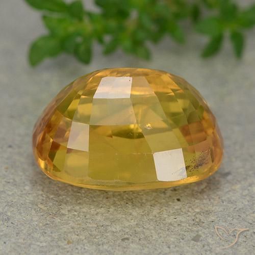 Zafiro Dorado naranja intenso natural de 9.36 ct, Ovalada, VS-SI
