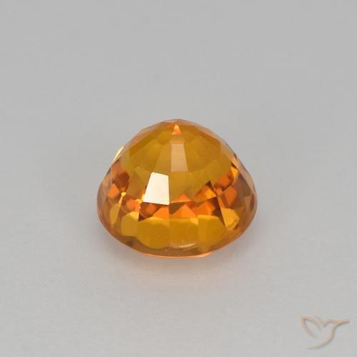 Zafiro Dorado naranja intenso natural de 0.98 ct, Redondo, VVS