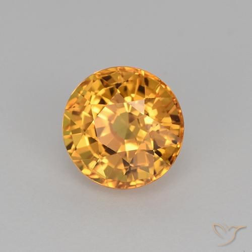 Zafiro Dorado naranja intenso natural de 1.06 ct, Redondo, VVS