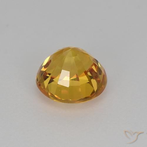 Zafiro Dorado naranja intenso natural de 1.06 ct, Redondo, VVS