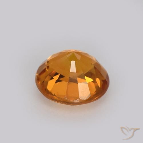 Zafiro Dorado naranja intenso natural de 0.99 ct, Redondo, VVS