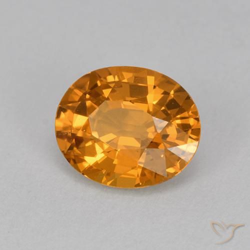 Zafiro Dorado naranja intenso natural de 1.14 ct, Ovalada, VVS