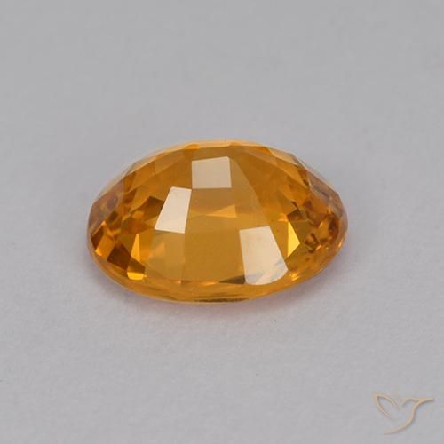 Zafiro Dorado naranja intenso natural de 1.14 ct, Ovalada, VVS