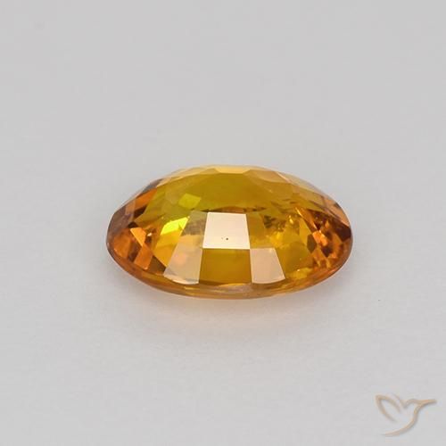 Zafiro Naranja terroso natural de 0.80 ct, Ovalada, VS