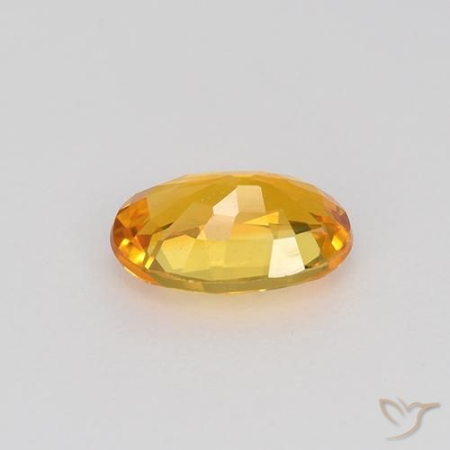 Zafiro Dorado naranja intenso natural de 0.67 ct, Ovalada, VVS-VS
