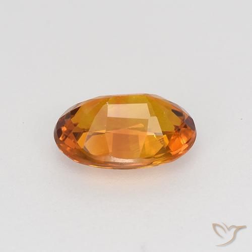 Zafiro Naranja oscuro natural de 0.77 ct, Ovalada, VVS