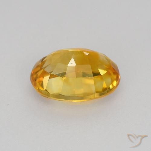 Zafiro Naranja dorado intenso natural de 0.86 ct, Ovalada, VVS