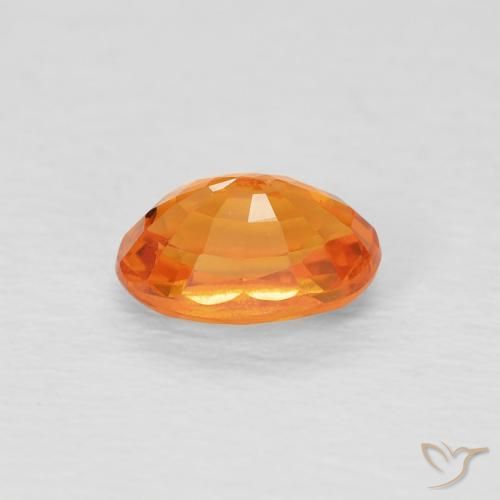 Zafiro Medium Light-Orange natural de 0.78 ct, Ovalada, VVS