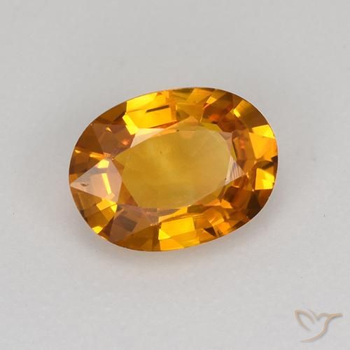 Zafiro Naranja medio natural de 0.77 ct, Ovalada, VS