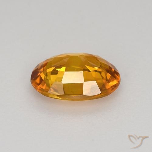Zafiro Naranja medio natural de 0.77 ct, Ovalada, VS