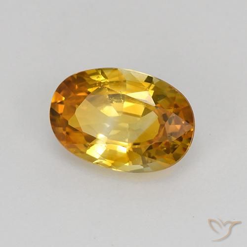 Zafiro Dorado naranja natural de 0.92 ct, Ovalada, VS