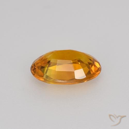 Zafiro Dorado naranja intenso natural de 0.72 ct, Ovalada, VVS