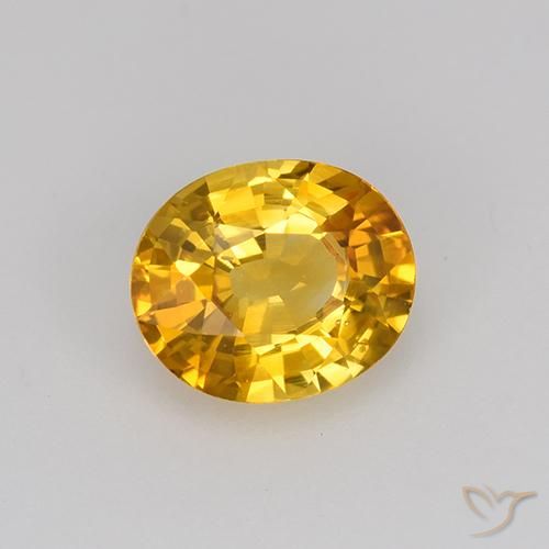 Zafiro Dorado-naranja medio natural de 0.84 ct, Ovalada, VS
