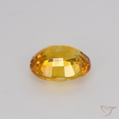 Zafiro Dorado-naranja medio natural de 0.84 ct, Ovalada, VS