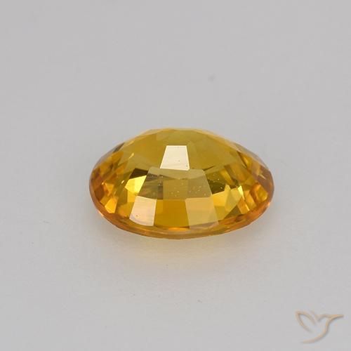 Zafiro Dorado naranja natural de 0.75 ct, Ovalada, VVS-VS