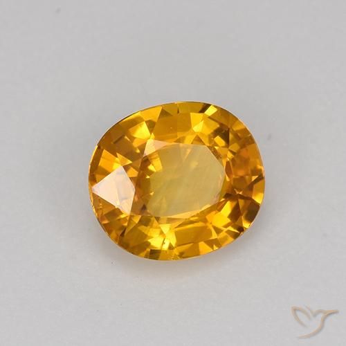 Zafiro Dorado naranja oscuro natural de 0.75 ct, Ovalada, VVS-VS