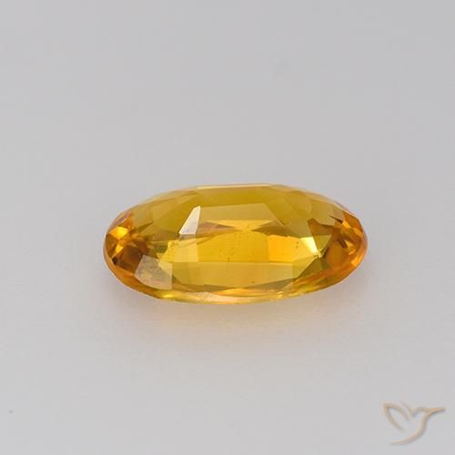 Zafiro Dorado naranja oscuro natural de 0.83 ct, Ovalada, VVS