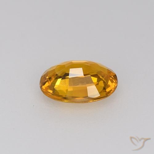 Zafiro Dorado naranja intenso natural de 0.71 ct, Ovalada, VVS
