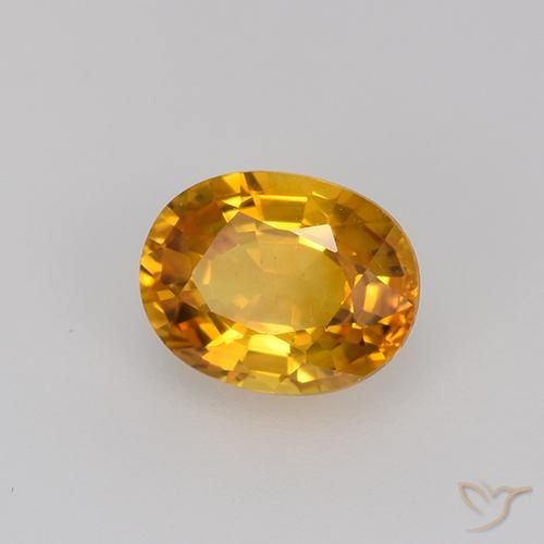 Zafiro Dorado naranja intenso natural de 0.81 ct, Ovalada, VVS