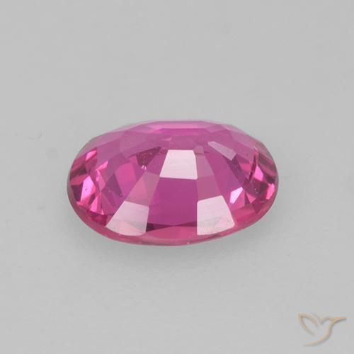 Zafiro Magenta intenso natural de 0.61 ct, Ovalada, VS