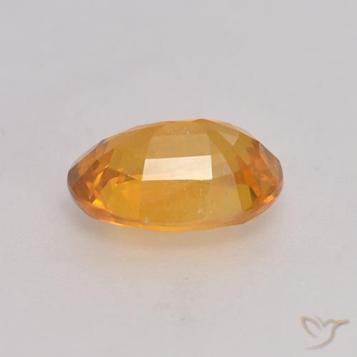 Zafiro Dorado naranja natural de 1.39 ct, Ovalada, VS