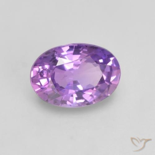Zafiro Violeta rosado vívido natural de 0.64 ct, Ovalada, VS