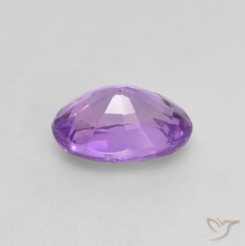 Zafiro Violeta rosado vívido natural de 0.64 ct, Ovalada, VS