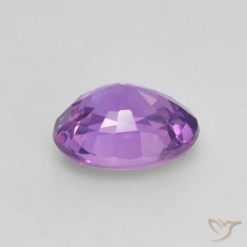 Zafiro Violeta rosado vívido natural de 0.56 ct, Ovalada, VS